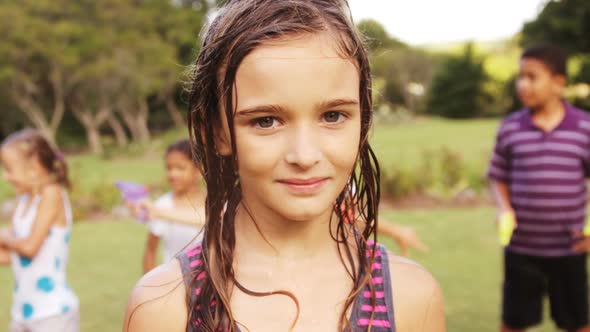 Portrait of girl smiling in garden alt