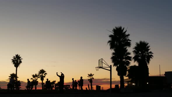 Players on Basketball Court Playing Basket Ball Game Sunset Beach California