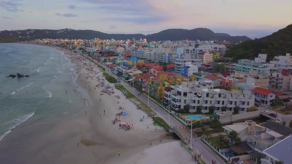 Aerial establishing shot revealing Bombas y Bombinhas just after sunset in Brazil