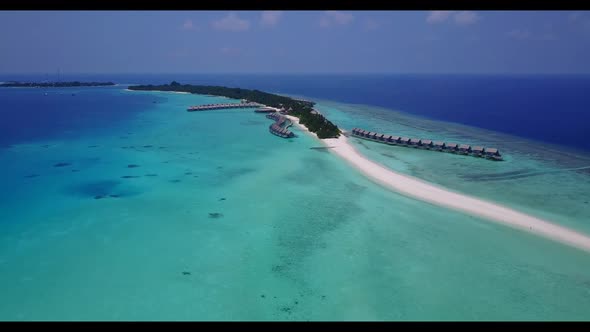 Aerial tourism of luxury seashore beach break by blue ocean with white sand background of a dayout n