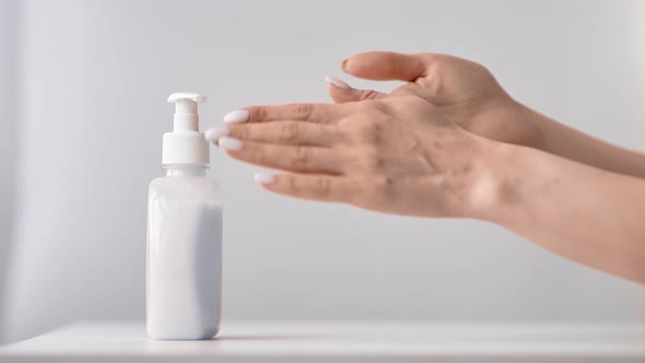 Close Up Woman Applying Sanitizer Gel to Disinfection Hands