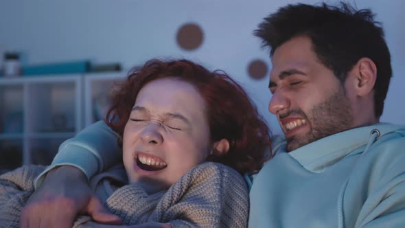 Man and Woman Watching Scary Film