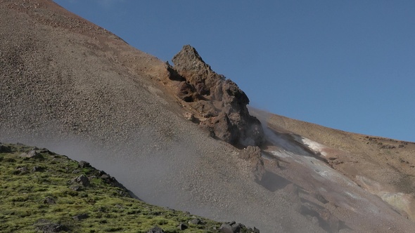 Environment. Iceland. Geyser in famous tourist attraction. Steam from fumarole in geothermal area.