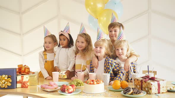 Caucasian Kids Celebrating Birthday at Home