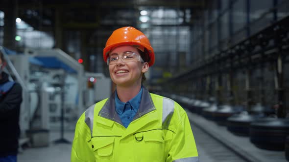 Joyful Engineer Laughing Safety Uniform at Modern Warehouse Say Hello Closeup