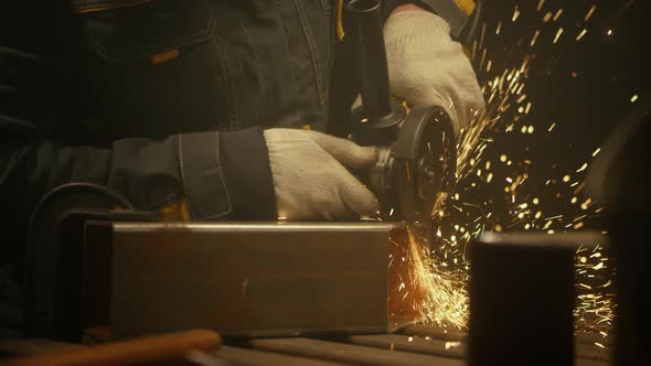 Industrial worker cutting metal