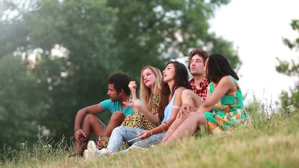 Group of friends having a great time taking selfies