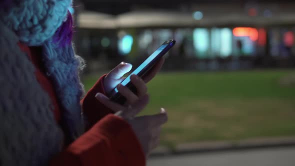 Closeup of Phone Display in Women's Hands