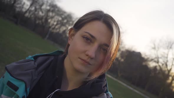 Portrait of Young Cute Attractive Young Girl in Park Background