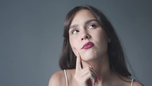 Portrait Pretty Young Brunette Student Thinking Look Up Right Left Finger Cheek