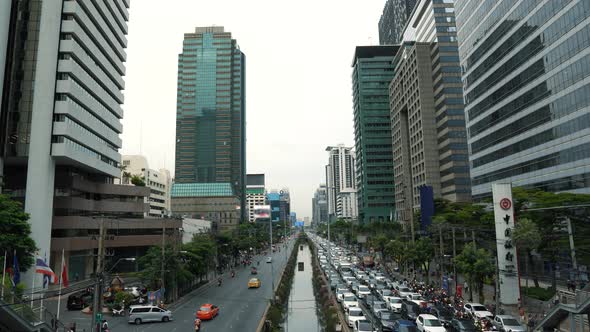 Traffic jam on the avenue in downtown at rush hour, daytime cityscape