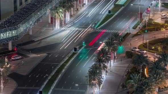 View of Intersection with Many Transports in Traffic Night Timelapse Aerial