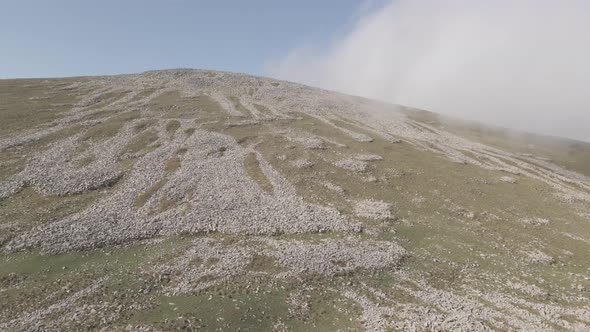 Scenic aerial view of moving white clouds at Abuli Mountain. Georgia