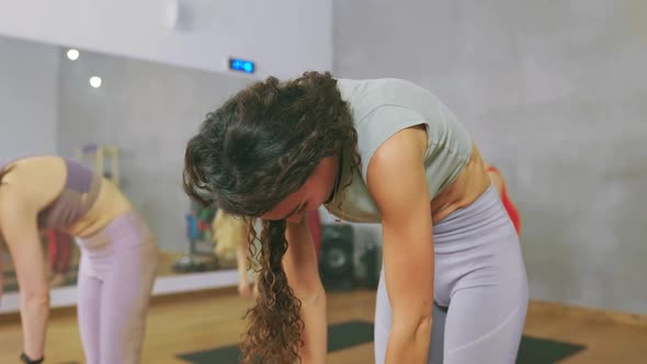 Young Beautiful Woman is Completing the Last Exercise Finishing Her Morning Workout in Positive Mood