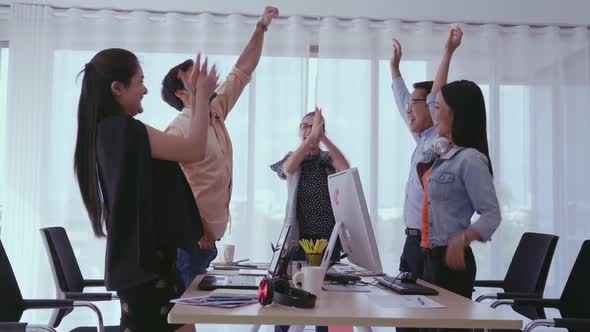 Successful Business People Celebrating Project Success at Office