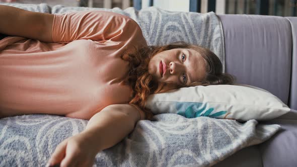 Boring Overweight Lady Lying on Couch at Home and Watching Tv Switching Channels Close Up