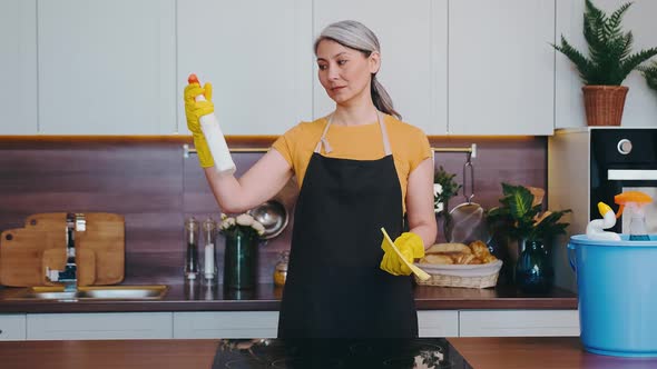 A Mature Woman is Unhappy with Her Cleaning Product