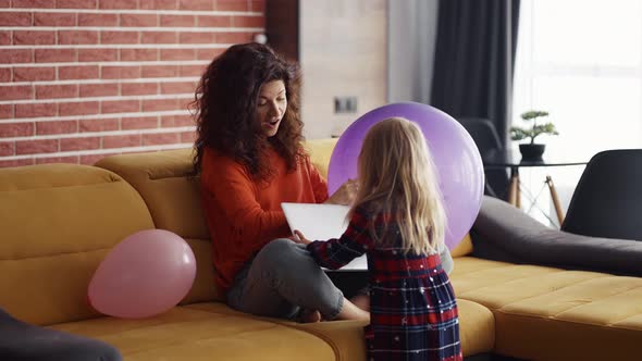 Busy Mother Working on Laptop Lack of Attention to Child Ask Her to Play