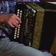 Senior Man Playing with an Old Accordion Outdoor Stage Sitting on Chair. - VideoHive Item for Sale