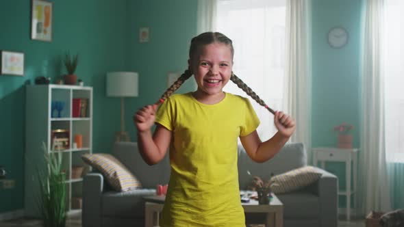 Portrait of Small Girl Making Faces