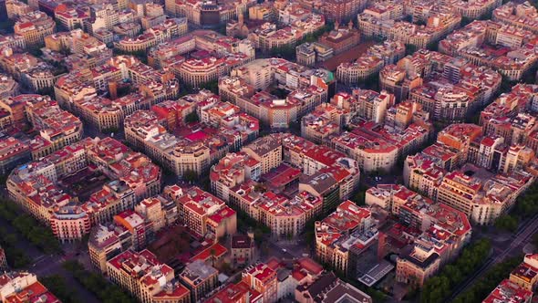 Aerial view of square blocks in new quarter of Barcelona at sunrise, Spain