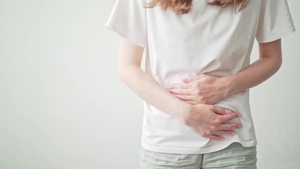 A Woman Holds on to Her Stomach During Her Period