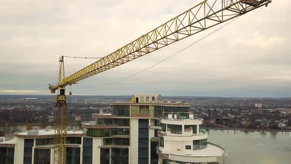 Aerial footage of a tower crane at construction site of new office building