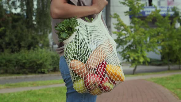Woman Carry An Eco Bag With Food