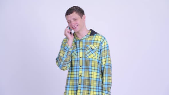 Happy Young Handsome Man Talking on the Phone