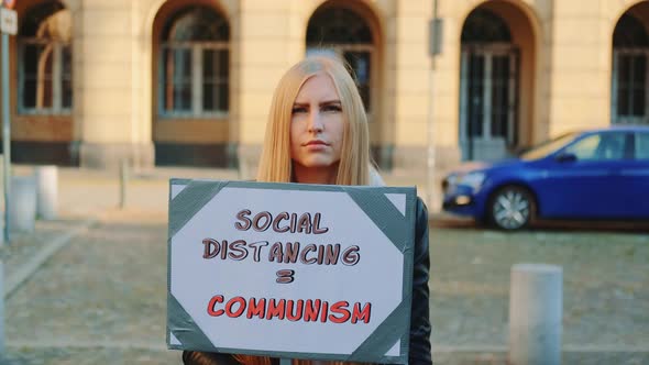 Woman's Protest Walk with Steamer Against Social Distancing That Equals Communism