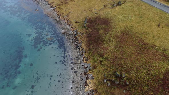 Drone Over Hiker Walking By Fjord