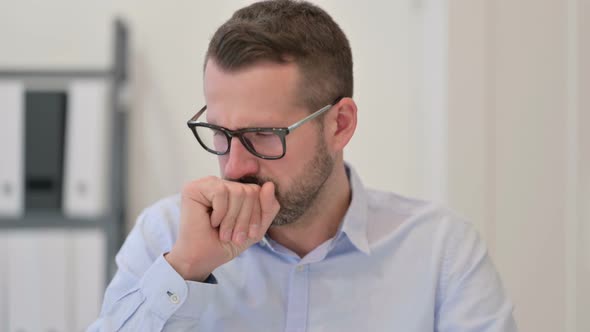 Portrait of Middle Aged Man Coughing