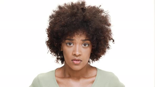 Displeased Young Beautiful African Girl Over White Background