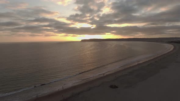 Low Aerial View of Ocean in San Diego, CA During Sunset