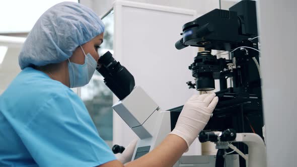 One Doctor Works with Modern Microscope in Clinic