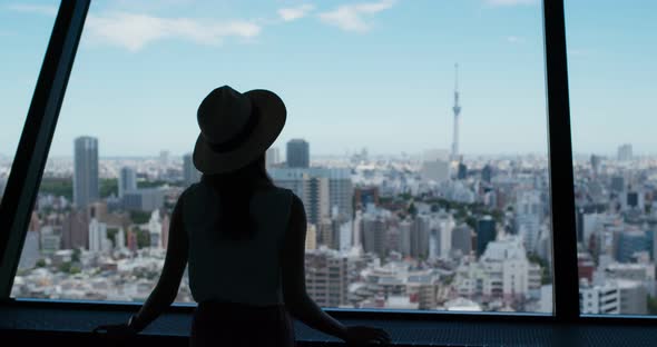 Woman Look at The City of Tokyo