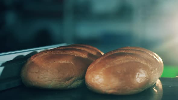 Loaves of Bread are Getting Mechanically Lifted