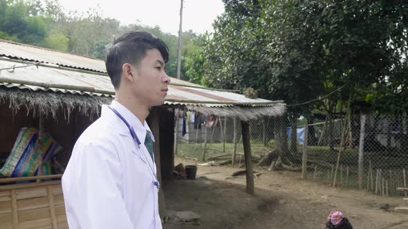 Asian Rural Doctor Walking