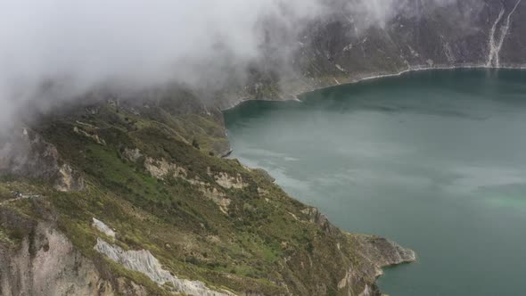 Aerial view of the Quilotoa lake in the crater of the vulcano showing the cliff and water