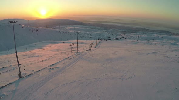 Ski-run and Snowy Hills at Sunset, Aerial View