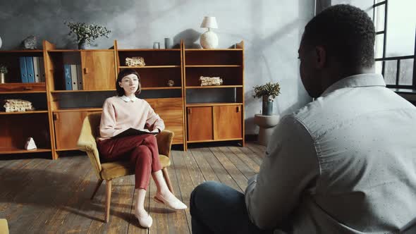 Female Psychologist Giving Advice to Afro-American Man