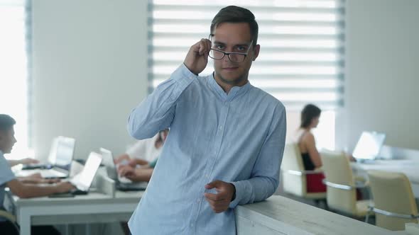 Portrait of Happy Office Worker Looking at Camera in Modern Office, Positive Male Employee 