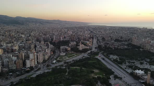 Done shot - Pan over Beirut during sunset showing southern suburbs and Beirut Airport