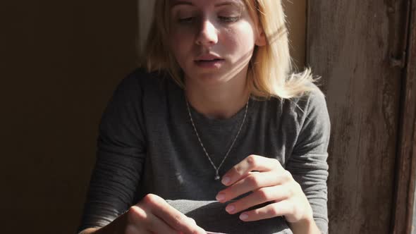 Sad woman holding a positive pregnancy test result