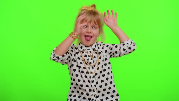 Funny Child Kid Girl Making Playful Silly Facial Expressions and Grimacing Fooling Showing Tongue