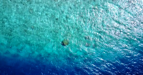 Natural drone travel shot of a white paradise beach and blue water background in best quality 4K