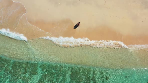 Boy and girl in love on exotic resort beach trip by blue sea with white sand background of Gili Traw