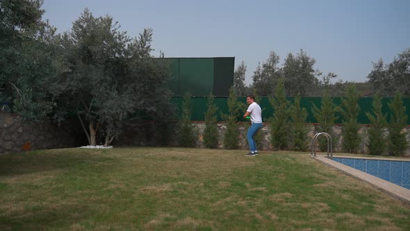 Man Jumps Hitting Frisbee with Head Launched By Friend