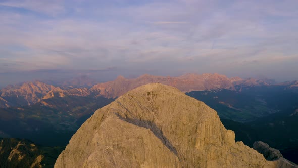 Breath taking golden hour sunrise aerial view orbiting above South Tyrol Plose Peitlerkofel epic mou