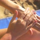the Girl Applying Sunscreen to the Sea - VideoHive Item for Sale
